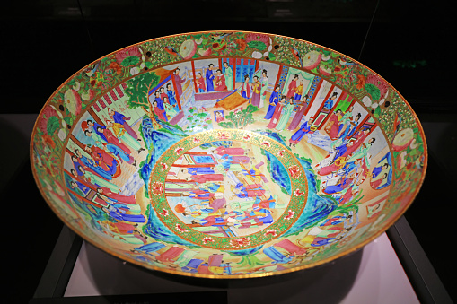 Guangzhou City, China - April 5, 2019: Ceramic bowls with traditional Chinese color figure paintings are in the museum, Guangzhou City, Guangdong Province, China