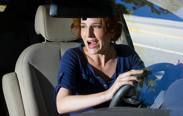 istock Female Driver Yelling and Bracing for a Car Crash Accident 187466734