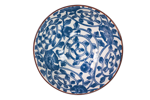 Vietnamese kendi in underglaze blue made of fired clay with lion and cloud motifs and decorated with  a band of lotus leaves around the base of the neck and the lower body. 