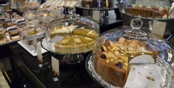 Snacks displayed on shelves in a bakery shop in a department store on Bangna-trad road Bangkok Thailand