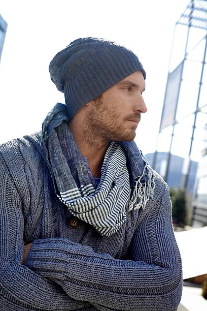 istock Trendy young man in hat and scarf 187469401