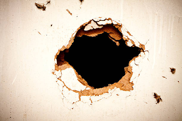 istock Hole in the fibreboard 187471141