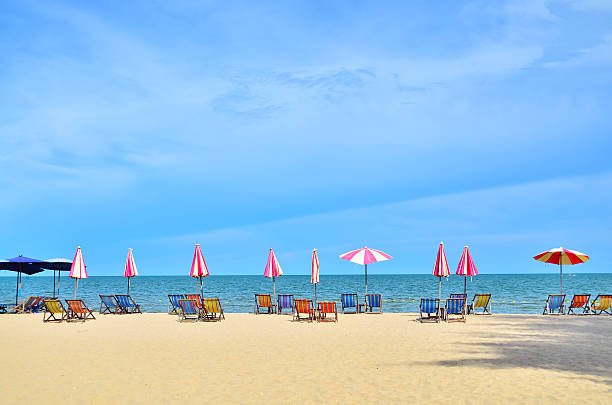 istock Chairs and umbellar on white sand beach. 187471465