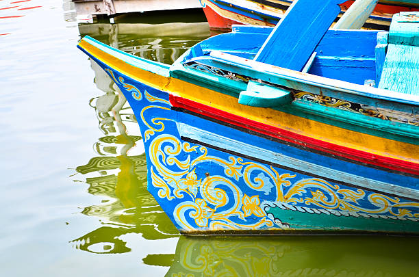 istock colorful long tail boat in Thailand 187472871
