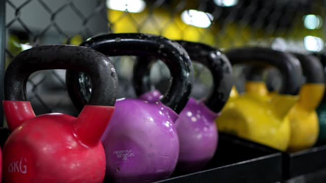 Kettlebells Of Different Weights In A Row In A Gym In Kuwait