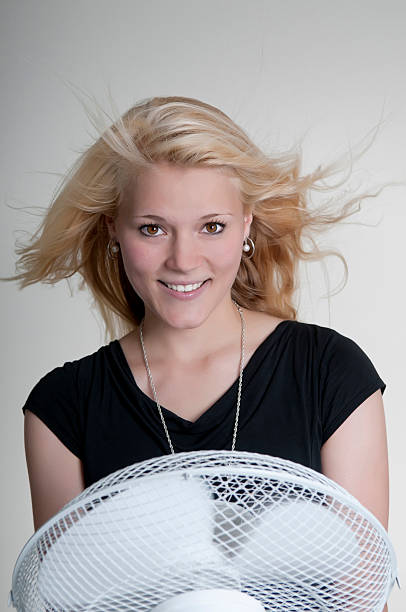 istock happy woman with fan 187474892