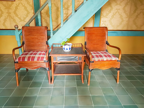 a set of rattan wooden table and chairs.