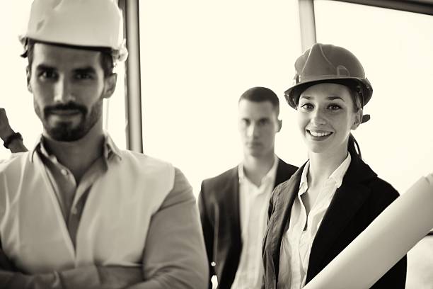 istock business people and engineers on meeting 187475116
