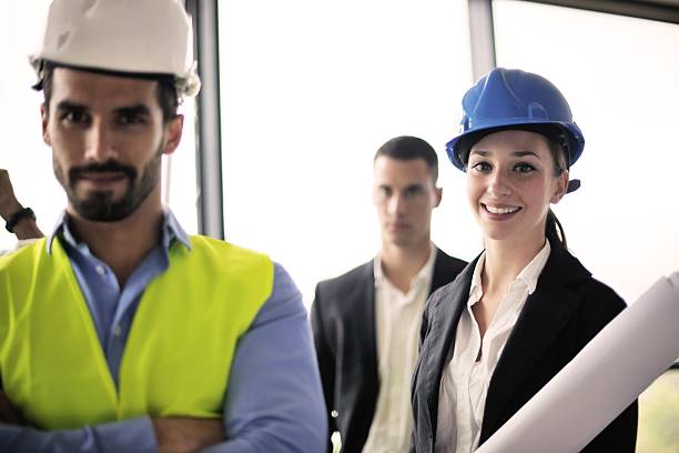 istock business people and engineers on meeting 187475462