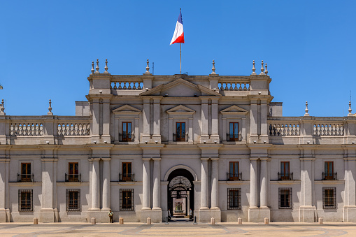 Santiago, Chile, January 7, 2018: A few guards are seen in this view of the otherwise empty facade of La Moneda Palace