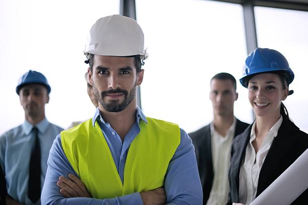 istock business people and engineers on meeting 187475736