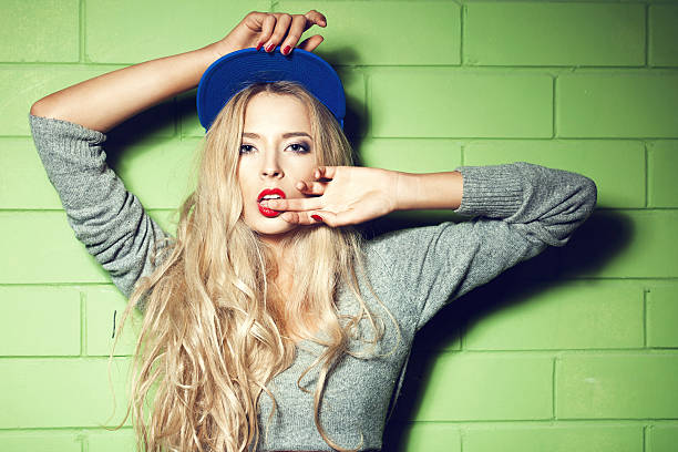 istock Young woman  in wall background 187476498