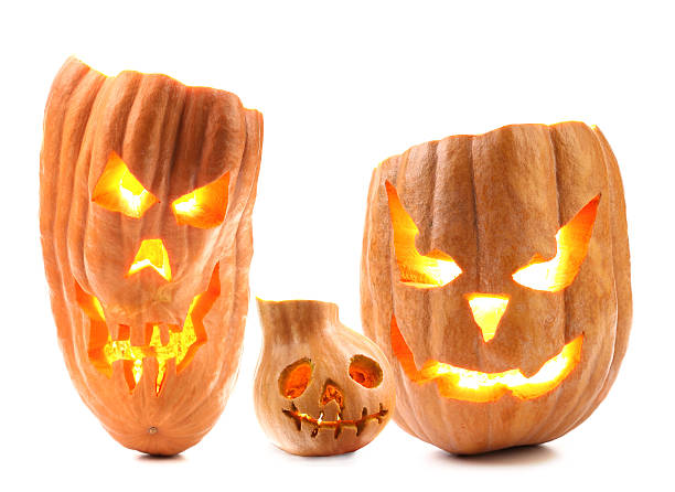 Halloween pumpkin with scary evil faces Halloween pumpkin with scary evil faces. Isolated on a white background halloween pumpkin human face candlelight stock pictures, royalty-free photos & images