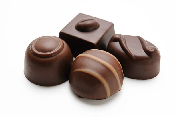 istock Isolated shot of four luxury chocolates on white background 187480656