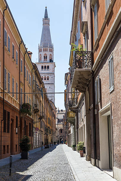 medieval street in old town of Modena, Italy stock photo