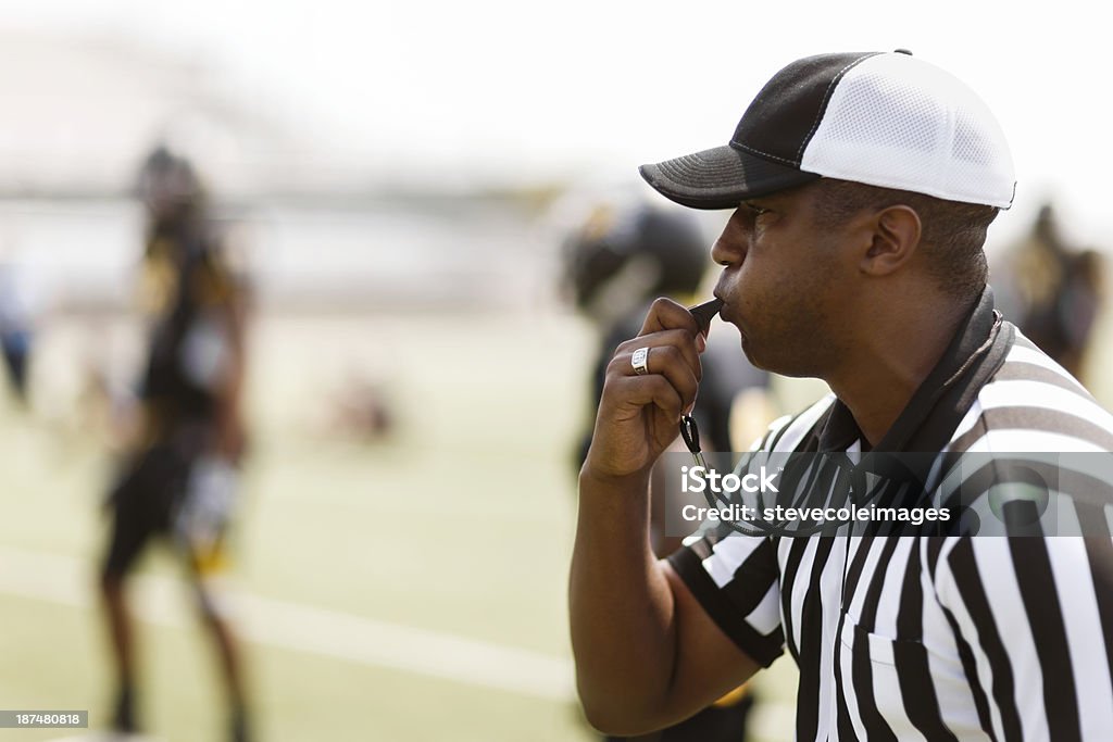 Football Referee A football referee blowing his whistle.    Referee Stock Photo