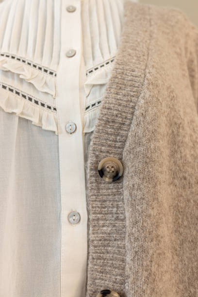 istock wool jersey and a blouse hanging in a clothing store 1874810286