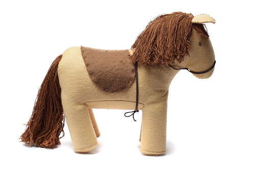 Brown horse toy on white background