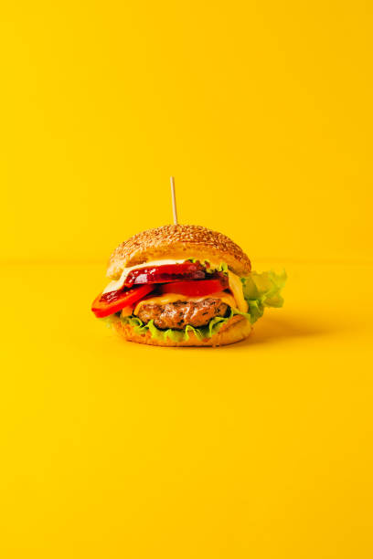 istock close-up of a hamburger on a yellow background 1874834809