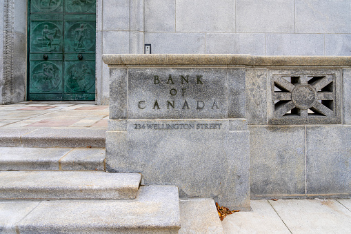 Bank of Canada sign on the building at the head office complex along Wellington street, Ottawa, Canada - October 15, 2023. The Bank of Canada is a Crown corporation and Canada's central bank.