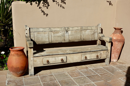 Wooden bench from a tree trunk for the garden