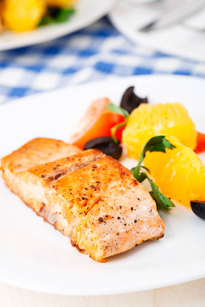 istock Salmon with oranges, tomatoes and olives 187484920