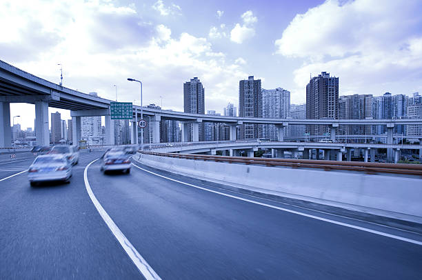 istock car running fast on the bridge in city 187484926