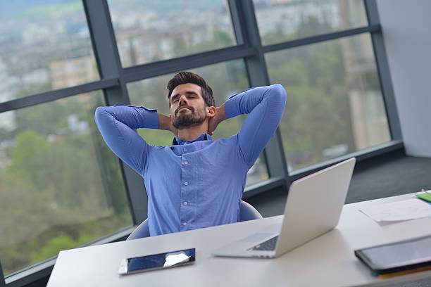 istock happy young business man at office 187485303
