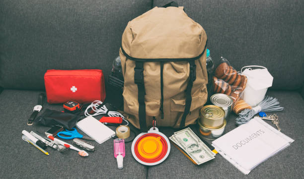 istock The packed backpack with items needed for evacuation. Emergency kit. Set of necessary things in case of accident or disaster 1874864016