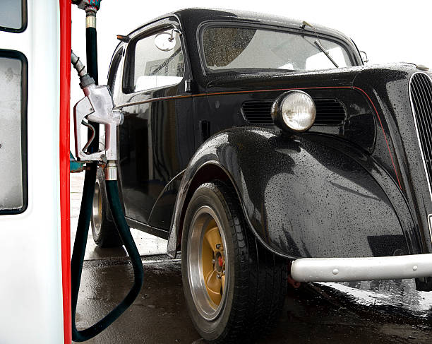 istock Vintage car at gas station 187492698