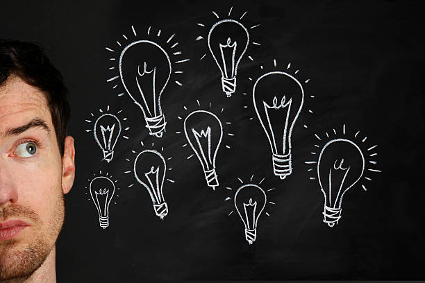 istock Man with Light Bulbs Near Head 