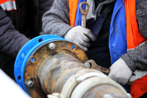 Workers install a cured-in-place pipe renewal systems