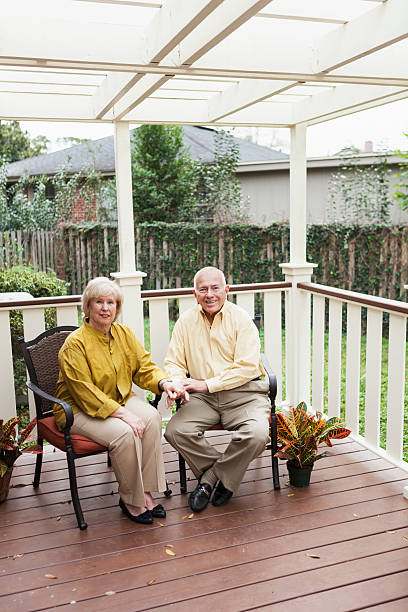 istock Senior couple sitting on porch 187493736