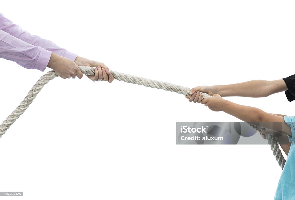 Tug of war between woman and children Tug of war between woman and children isolated on white Tug-of-war Stock Photo