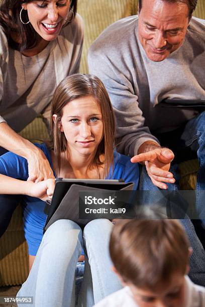 Family Using Digital Tablet Stock Photo - Download Image Now - 10-11 Years, 12-13 Years, 14-15 Years