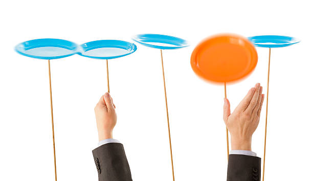 istock Business hands try to keep plates spinning 187494983