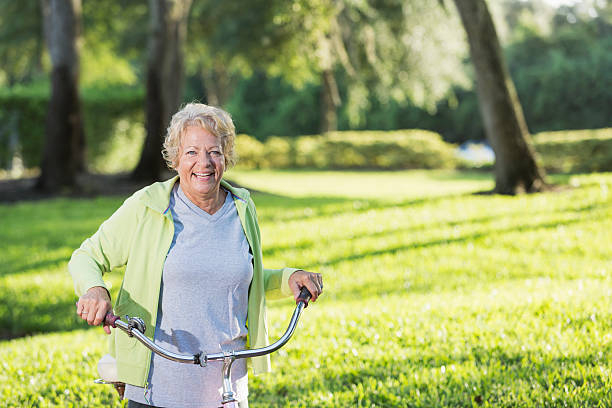 istock Senior woman riding bicycle 187495693