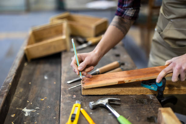 istock Female carpenter working in her workshop, close-up 1874962323