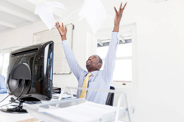 istock Businessman throwing his paperwork in the air with joy! 187497182