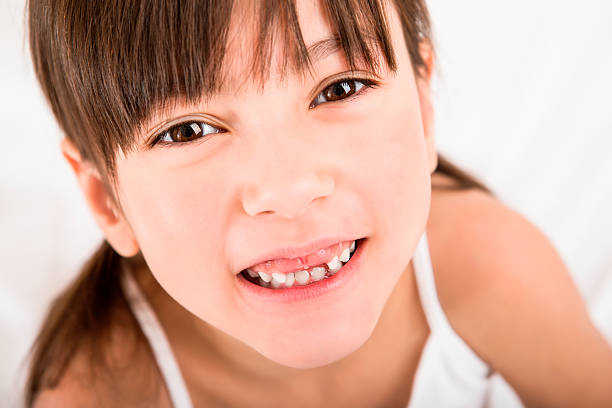 istock Young girl laughing in bed 187497272