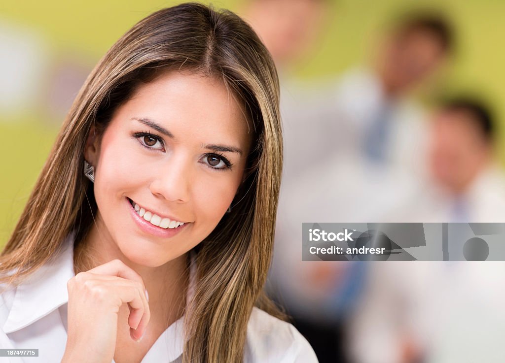 Beautiful business woman Portrait of a beautiful business woman smiling Adult Stock Photo