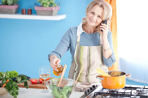 istock Senior woman cooking. 187497807