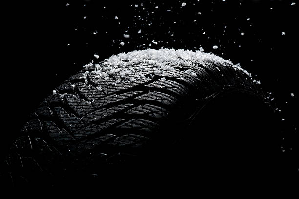 istock New tire covered with snow 187498744