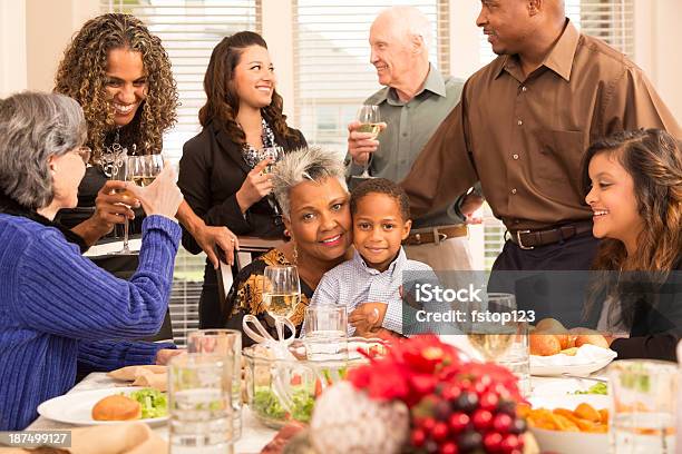 Relationships Family Friends Gather For Christmas Dinner Or Holiday Party Stock Photo - Download Image Now