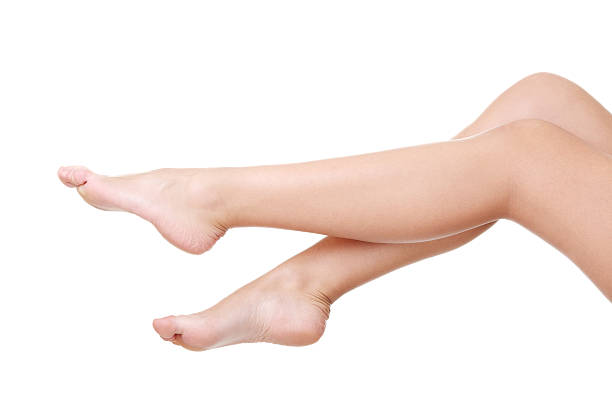 istock Female's bare feet and legs. 187499686