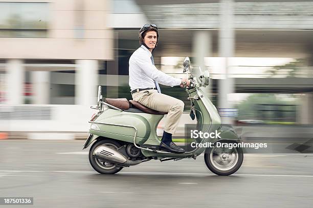 Businessman On Wheels Stock Photo - Download Image Now - City, Motor Scooter, Businessman