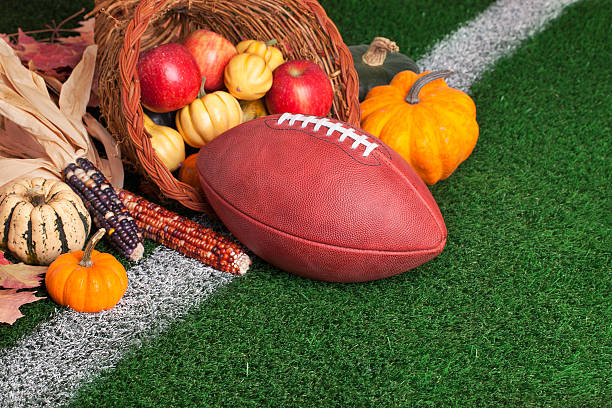istock Football with a cornucopia on grass field 187501586