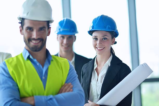 istock business people and engineers on meeting 187503052