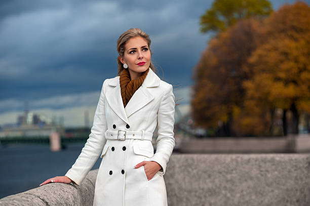 istock Young blond woman in a white coat 187504672