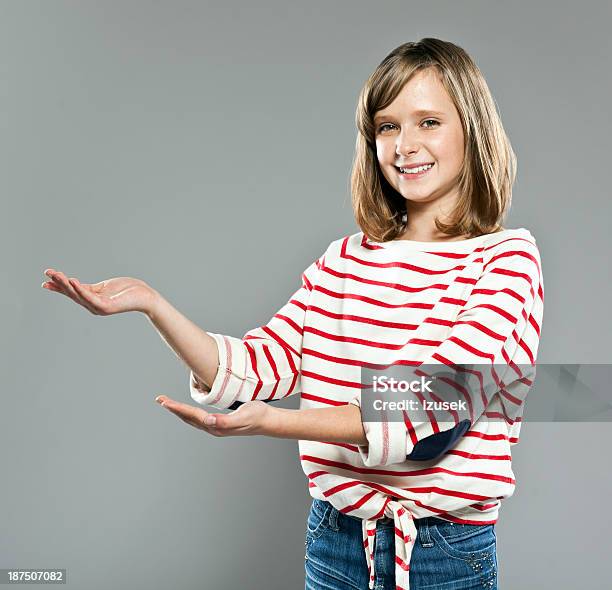 Schoolgirl Pointing Stock Photo - Download Image Now - 10-11 Years, Adolescence, Beautiful People